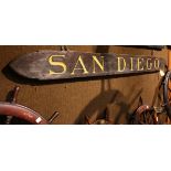 Carved nameboard reading "San Diego" with gilt lettering, 11"h x 117"w Property from the Spenger's
