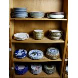 Four shelves of assorted Continental and American porcelain dishes, examples include Limoges,