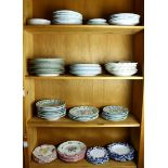 Four shelves of assorted Continental porcelain and faience dishes, examples include KPM porcelain