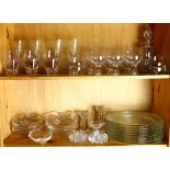 Two shelves of assorted crystal and glass table articles, including crystal wine goblets, having a