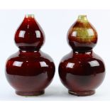 Pair of Chinese Langyao porcelain vases, of double gourd form, coated with a mottled red glaze, 13.