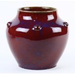 Chinese flambe glazed porcelain jar, with a short neck and rounded shoulders with raised bosses,
