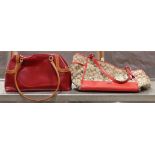 (lot of 2) Ladies handbag group, one executed in red with a tan colored double strap, the other with