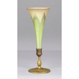 Tiffany Studios dore bronze and favrile glass vase, having a pulled iridescent trumpet insert rising