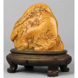 Chinese soapstone boulder, both sides carved with figures travelling through landscape executed from