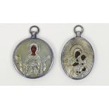 (lot of 2) Russian traveling icons, each having a silver oklad, one depicting the Mother of God, the