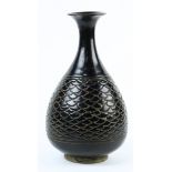 Chinese Cizhou-type bottle vase, the yuhuchunping of a dark glaze incised with fish scale pattern to