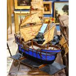 Model of a three masted Spanish galleon, having a painted blue hull, 24"l. Provenance: Property from