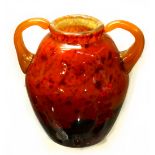 Art glass vase, the double handled ovoid vase having a burnt orange ground with rust speckled