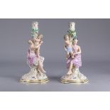 (lot of 2) Meissen figural candlestick group 19th century, each depicted holding a child, one figure