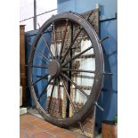 Monumental ships wheel, executed in mahogany and brass, 8'10" dia. Provenance: Property from the