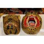 (lot of 2) Carved and polychrome decorated leopard masks, both with mouths open and one with