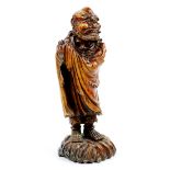 Chinese carved wood figure, of bodhidharma standing and draped in a monastic robe, stand on a a