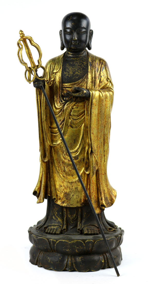 Chinese statue of Dizang, holding a staff in the right hand and a sacred jewel in the left,