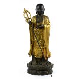 Chinese statue of Dizang, holding a staff in the right hand and a sacred jewel in the left,