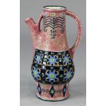 Amphora style glazed ceramic pitcher, having a pink ground with stirrup handles, the baluster form