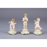 (lot of 3) Meissen figural group, depicting three putti, two holding hearts, and one with its