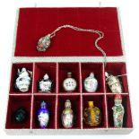 (lot of 11) Chinese snuff bottles: including two porcelain, one Yixing enameled zisha; five glass;