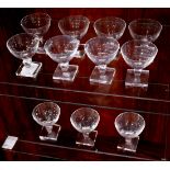 (lot of 11) Orrefors crystal Gustav Adolf sherberts, each having a shallow bowl and rising on a