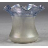 Steuben vase, executed in iridescent opalescent glass, with a light blue tint, having a ruffled rim,