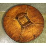 Bangsa Moro Philippines round wood shield, with red pigment, having an old woven repair, 27.5"