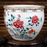 Chinese enameled porcelain fish bowl, decorated with peonies and butterflies in famille rose, the