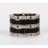 Black onyx, diamond and 14k white gold ring Featuring (24) rectangular black onyx plaques, measuring