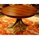 Modern Alma breakfast table, having a circular top, above a quadruped base, 29"h x 48"dia.