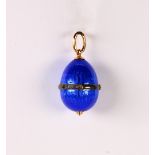 Russian Ananov diamond, enamel, sterling silver and 14k yellow gold egg pendant Featuring royal blue