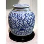 Chinese underglazed blue porcelain lidded jar, the rounded body decorated with floral tendrils, with