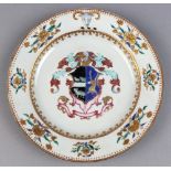Chinese export armorial porcelain plate, centered with a helmet above a shield with a deer and