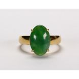 Jadeite and 14k yellow gold ring Featuring (1) green jadeite cabochon, measuring approximately 9.