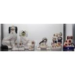 (lot of 10) Staffordshire style pottery group, including (5) assorted spaniel figurines, the largest