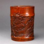 Chinese bamboo brush pot, carved with figures on a boat in a river, backed by tall rocky cliffs, 7"