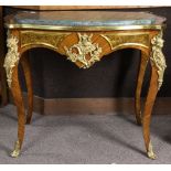 Louis XV style gilt bronze mounted marble top table, having an inset top above the bronze mounted
