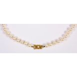Mikimoto cultured pearl and 18k yellow gold necklace Composed of (57), 7.0 mm cultured pearls,