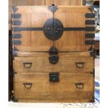 Japanese two-part tansu chest, upper section with four drawers of various sizes behind the double