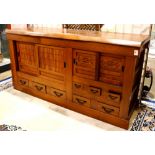 Japanese tansu chest, two sliding door sections, each with an interior shelf, above five drawers
