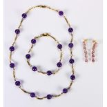 Amethyst and 14k yellow gold jewelry suite Including 1) pair of pear-cut amethyst and 14k yellow