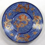 Chinese large porcelain charger, interior with five gilt enameled dragons and bats amid underglaze