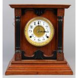 Victorian mantle clock, by Fattorini & Sons Bradford, a wooden case framing the round enamel dial