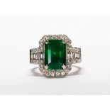 Emerald, diamond and platinum ring Featuring (1) emerald-cut emerald, weighing 5.31 cts.,