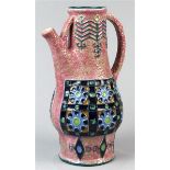 Amphora style glazed ceramic pitcher, having a pink ground with stirrup handles, the baluster form