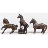 (lot of 3) Cast iron still horse banks, consisting of one prancing, one standing on all four legs;
