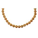 Golden cultured pearl, diamond and 14k white gold necklace Composed of (39) graduating golden