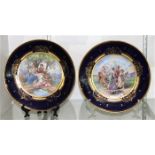 (lot of 2) Royal Vienna porcelain plate group, each plate with a partial gilt and cobalt decorated