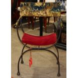 Continental Savonarola style bronze chair, having a tapestry upholsterd back with floral decoration,