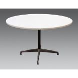 Mid-Century Modern dining table, in the manner of Charles and Ray Eames, having a circular white
