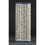 Chinese porcelain wrist rest, in the form of a scroll, the text followed by the cyclical date