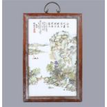 Chinese enameled porcelain plaque, painted with a riverside landscape with figures and pavillions,